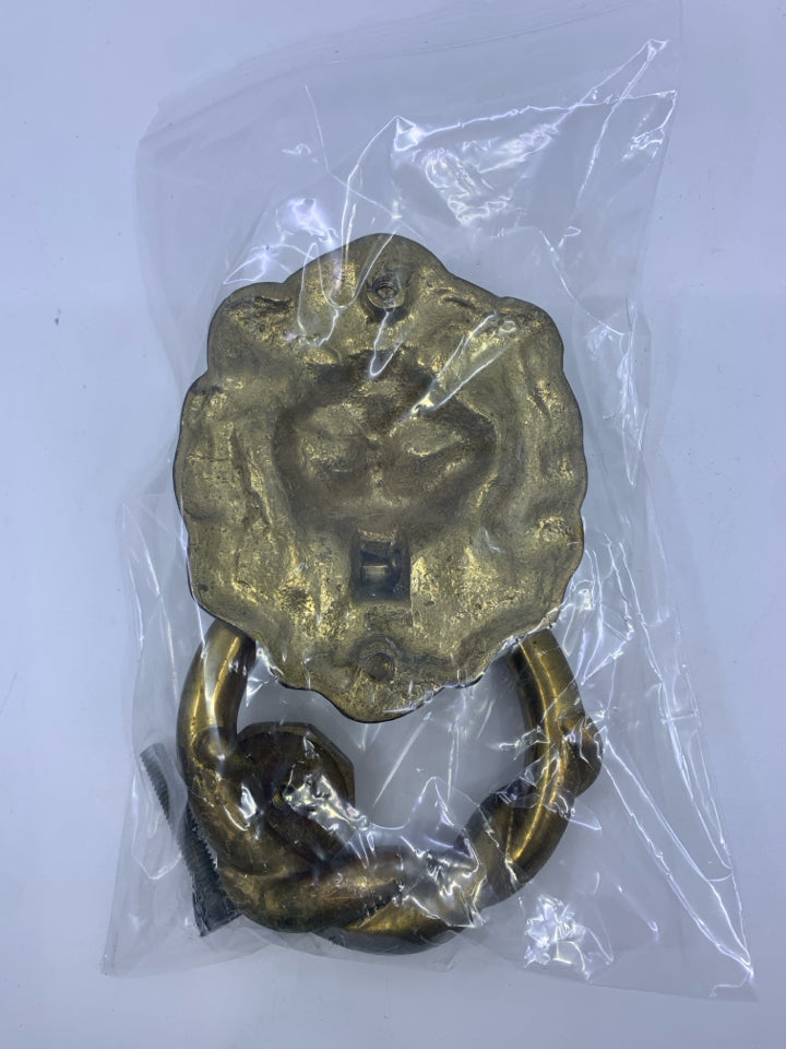 BRASS? LION DOOR KNOCKER W/ HARDWARE IN BAG.