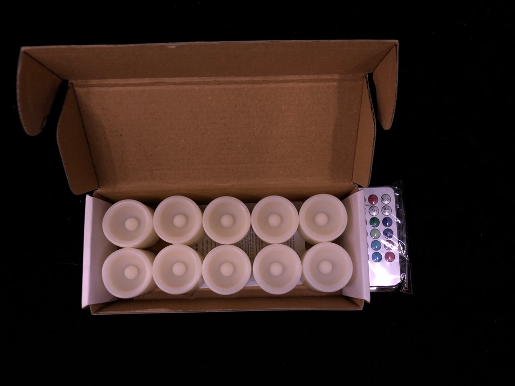 10PC FLAMELESS VOTIVE CANDLES IN BOX.