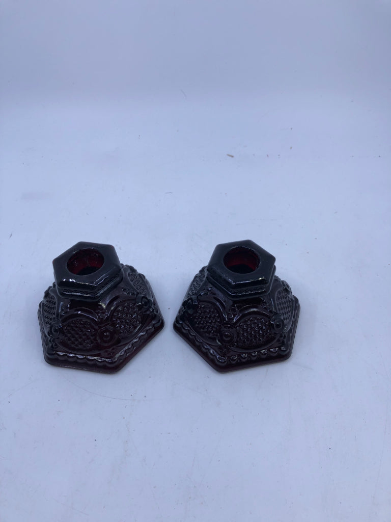 2 CRANBERRY GLASS TAPER CANDLE HOLDERS.