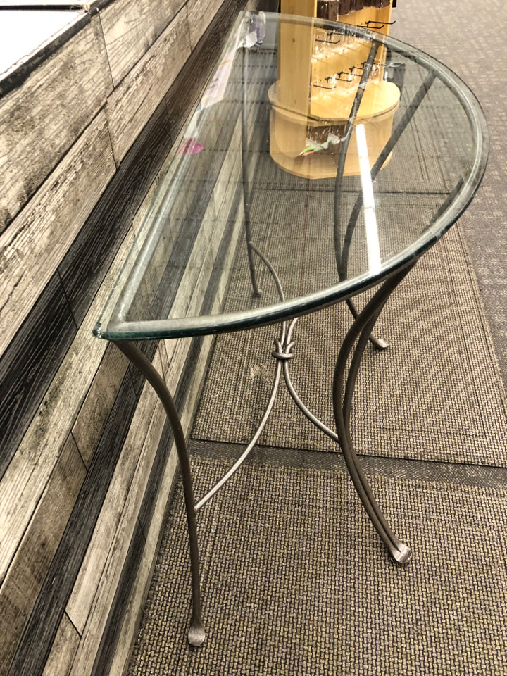 HEAVY METAL GREY HALF CIRCLE WALL TABLE WITH GLASS TOP.