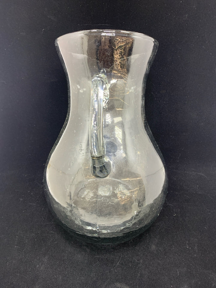 TILTED BLOWN GLASS PITCHER.