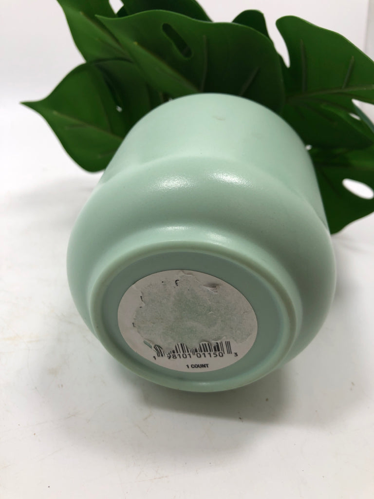 FAUX MONSTERA IN TEAL PLANTER.