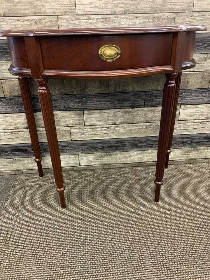MAROON HALF MOON TABLE W 1 DRAWER.