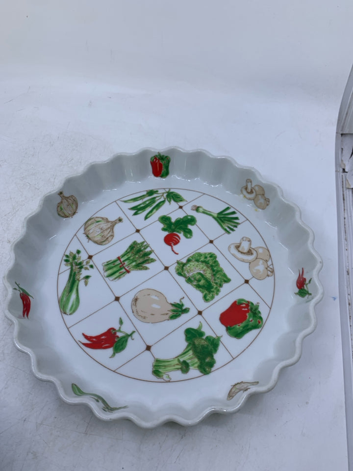 WHITE QUICHE DISH W/ ASSORTED VEGGIES.