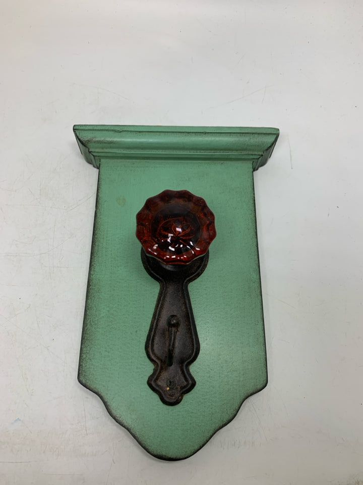 RUSTING DOOR KNOB HOOK WALL HANGING.