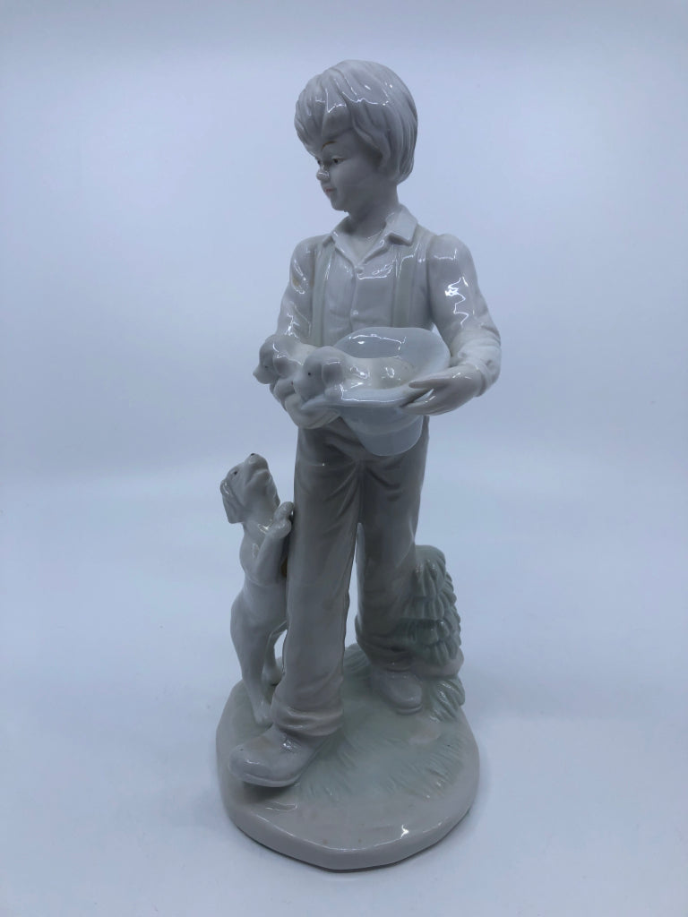 BOY W/DOGS PORCELAIN FIGURINE.