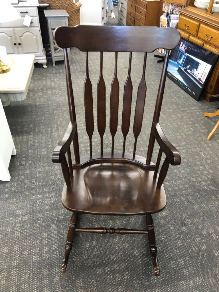 DARK WOOD ROCKING CHAIR.