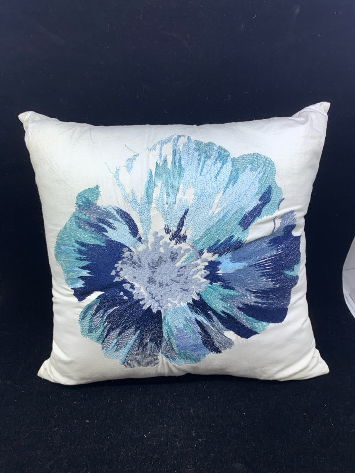 SQUARE WHITE PILLOW W/BLUE FLOWER.