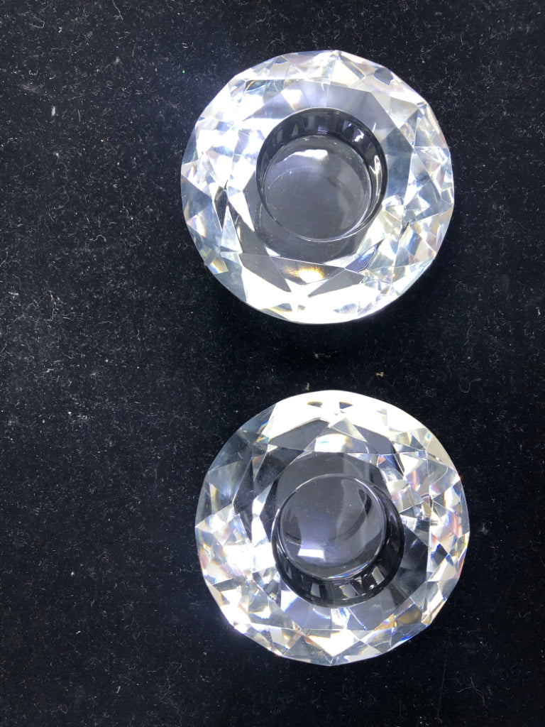 2 CRYSTAL CUT GLASS CANDLE HOLDERS.