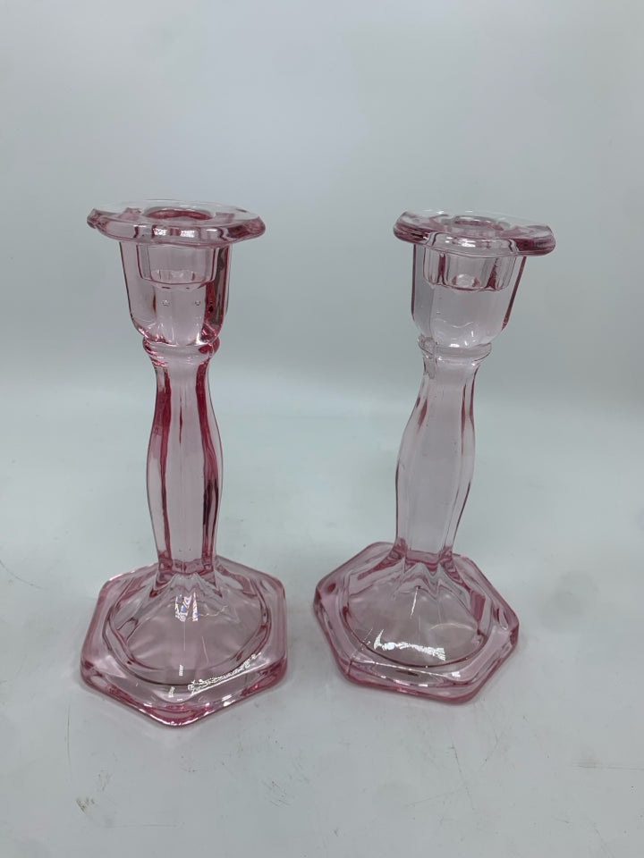 2 PINK GLASS CANDLE HOLDERS.