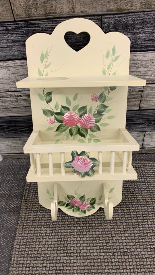 CREAM/ROSE WALL HANGING SHELF.