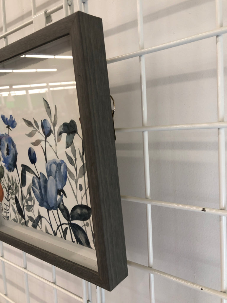 BLUE PAINTED FLORALS IN SM GRAY FRAME.
