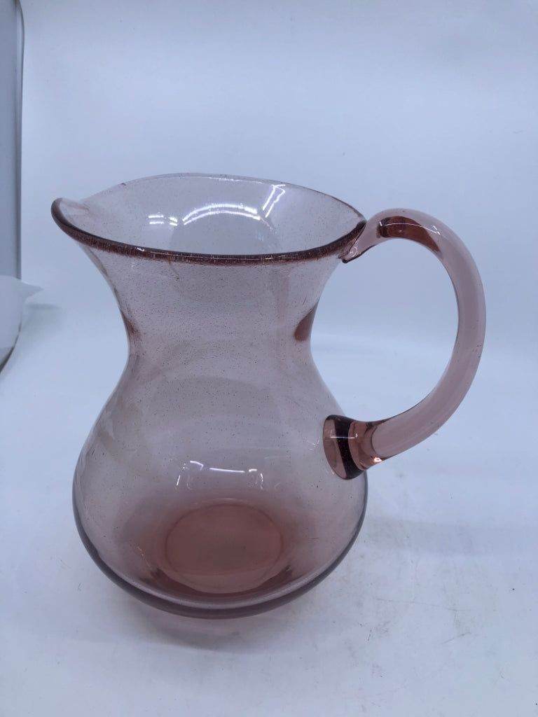 PINK GLASS PITCHER W/HANDLE.