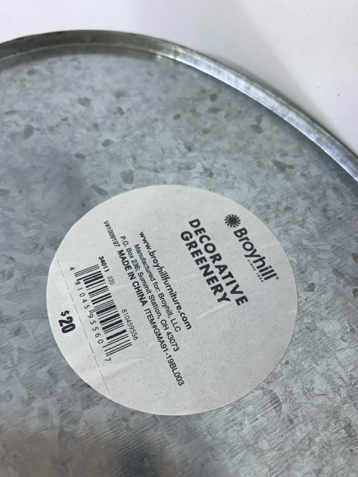 FAUX LEAVES & CREAM FLOWERS IN GALVANIZED TIN.