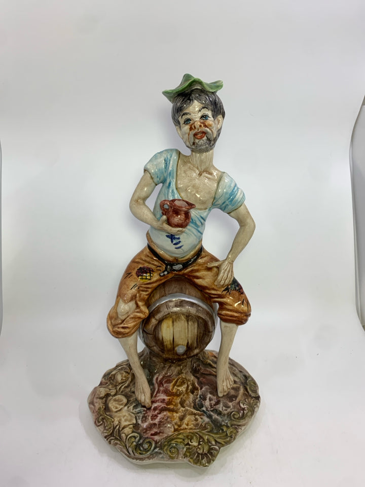 VTG CAPODIMONTE PORCELAIN MAN SITTING ON BARREL FIGURINE.