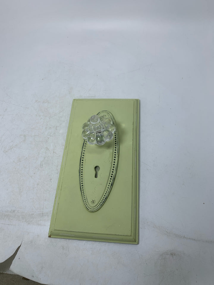 LIME GREEN DOOR KNOB WALL HANGING.