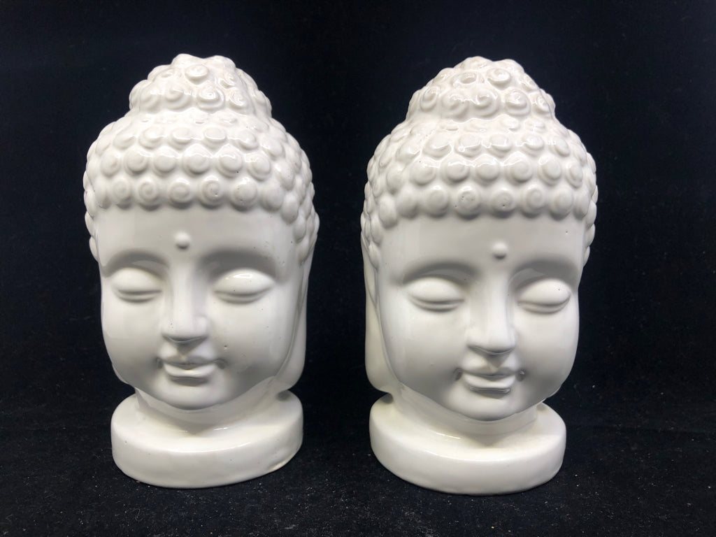 2 WHITE CERAMIC BUDDHA HEADS.