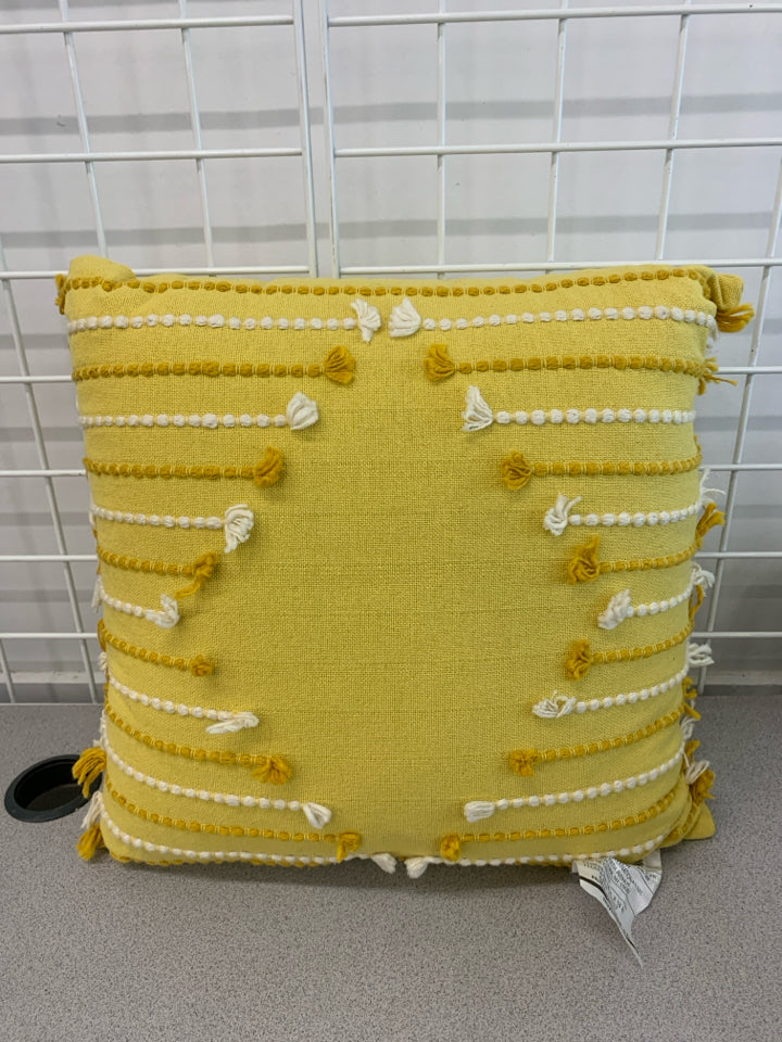 YELLOW STITCHED PILLOW.