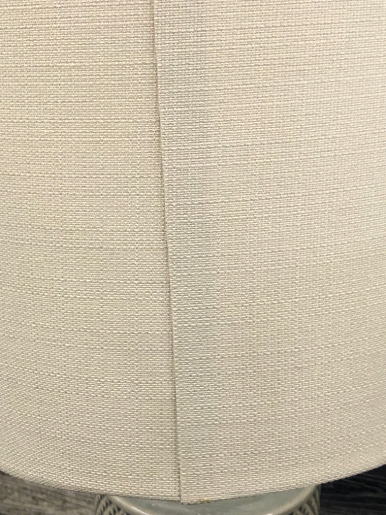 GREY CERAMIC TEXTURED LAMP W/ TAN SHADE.