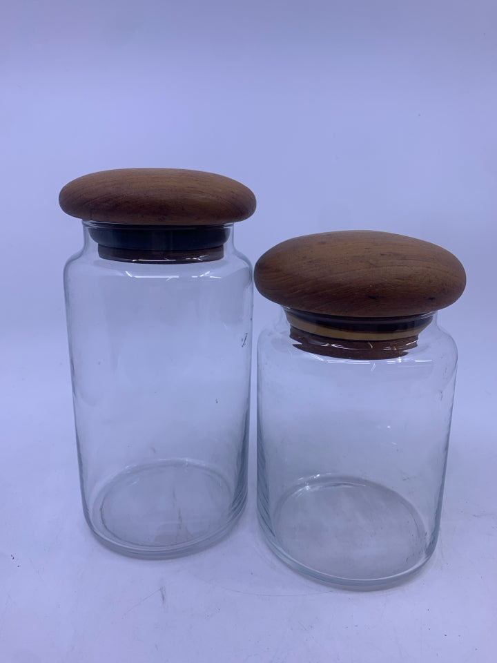 2 VTG CLEAR GLASS CANISTERS-WOOD TOPS.