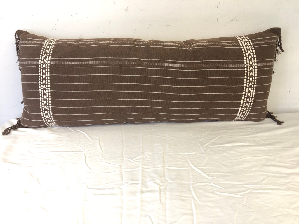 LONG BROWN PILLOW W/STRIPES.