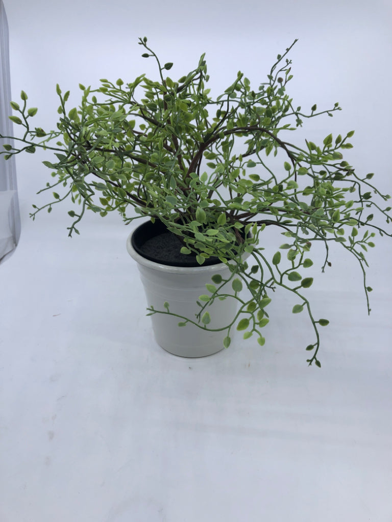 WHITE METAL PLANTER W/ FAUX VINE STYLE PLANT.