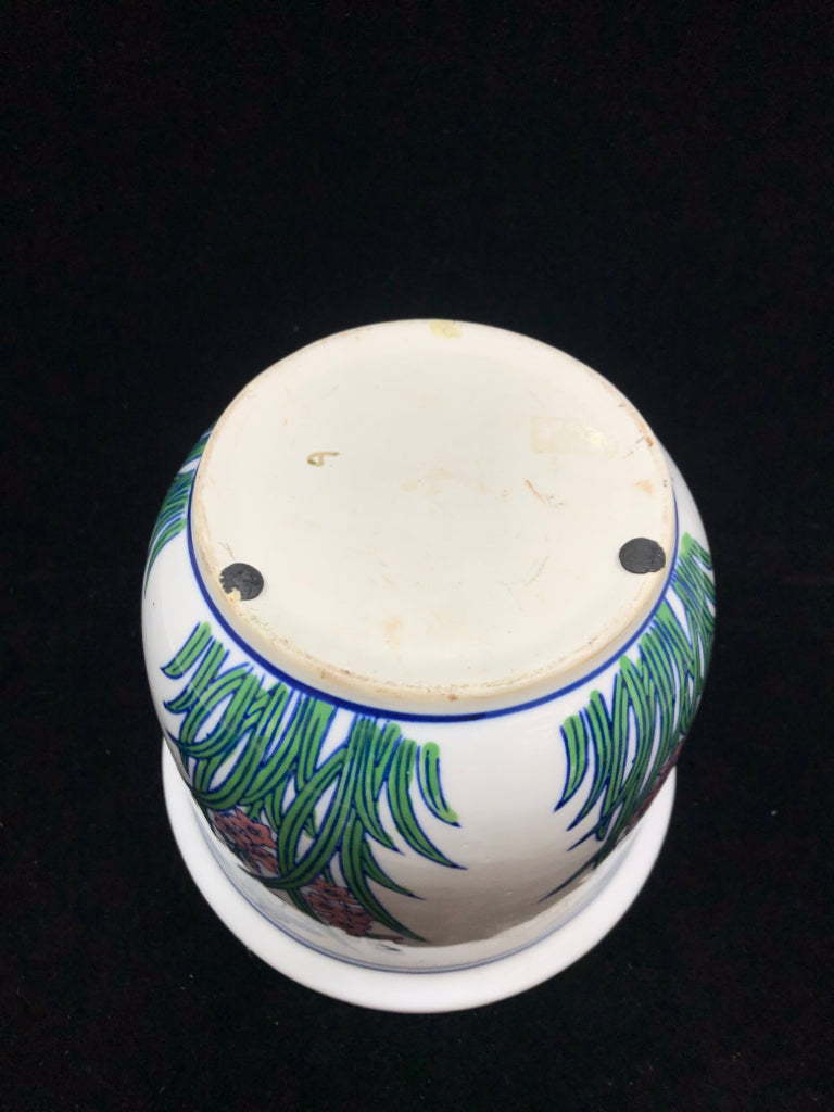 PINK FLOWER PAINTED PLANTER W/BLUE RIM.