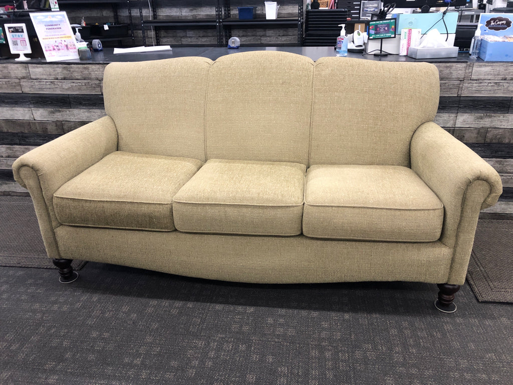 ARTICHOKE GREEN SOFA W/ BROWN WOOD LEGS.