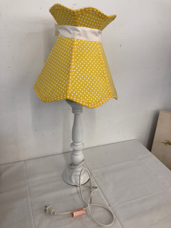 WHITE BASE LAMP W YELLOW SHADE.