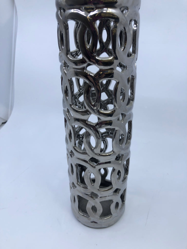 TALL SILVER PIERCED VASE.