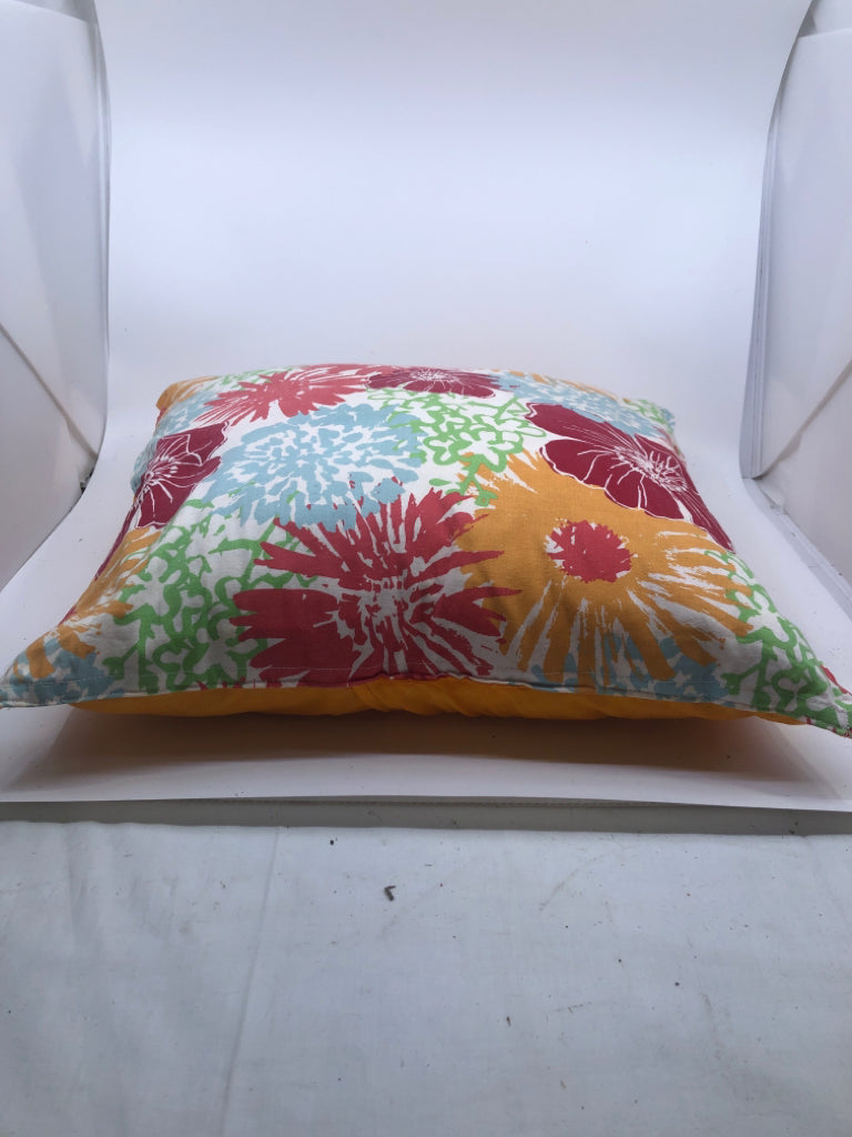 COLORFUL FLOWER W/ SOLID ORANGE BACK PILLOWS.