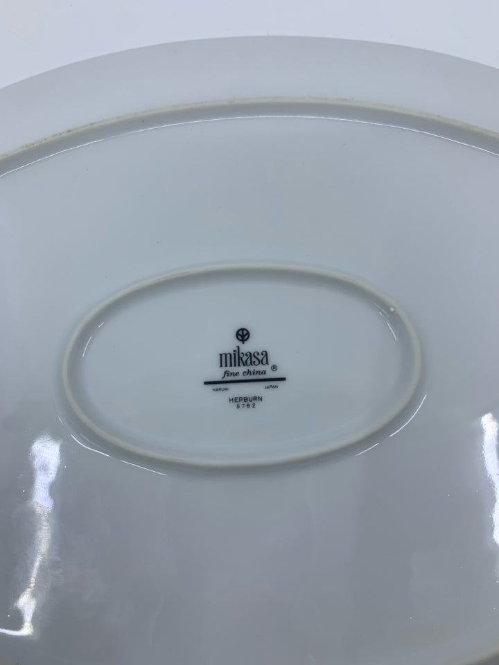 WHITE OVAL PLATTER W/ BLUE FLOWERS & GREEN DETAILS.