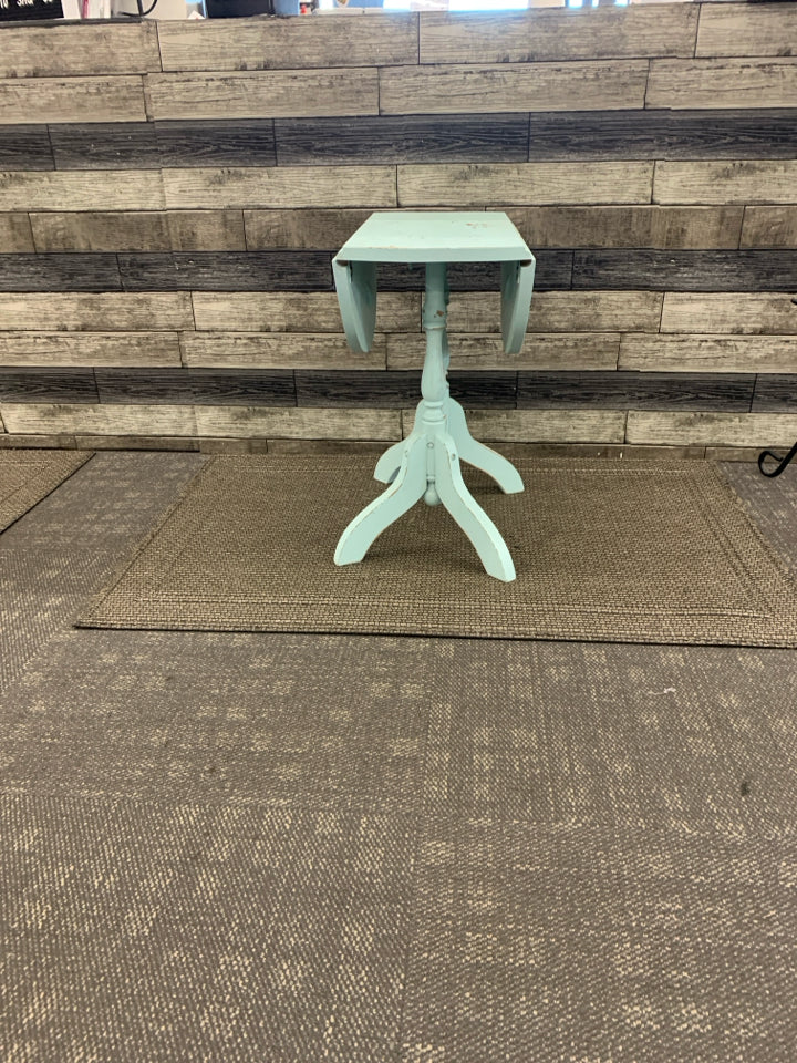 LIGHT BLUE OVAL DROP LEAF SIDE TABLE.