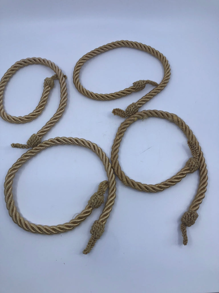 4 GOLD ROPE CURTAIN TIE BACKS.