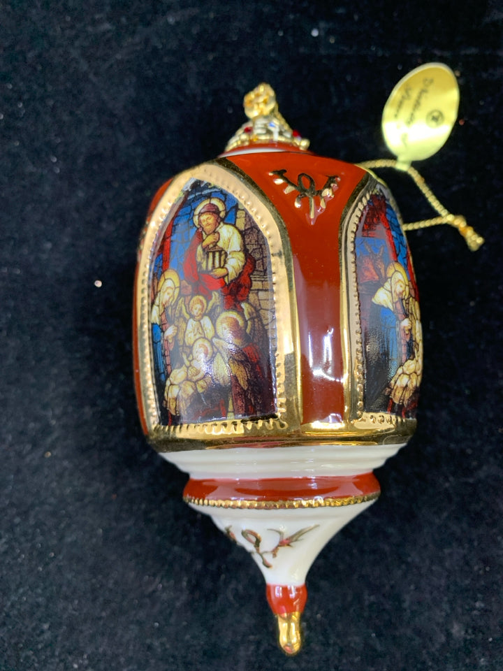 CERAMIC NATIVITY OF PEACE ORNAMENT.