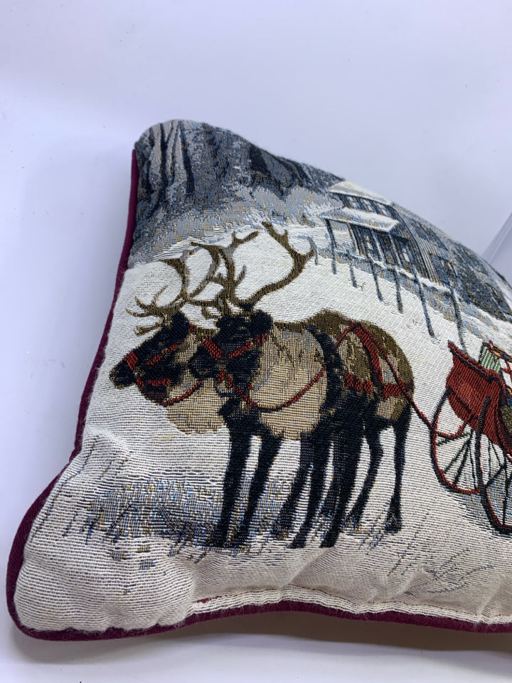 REINDEER AND SLED PILLOW.