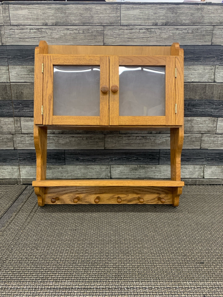 OAK WOOD SHELF W CABINET AND 6 HOOKS.