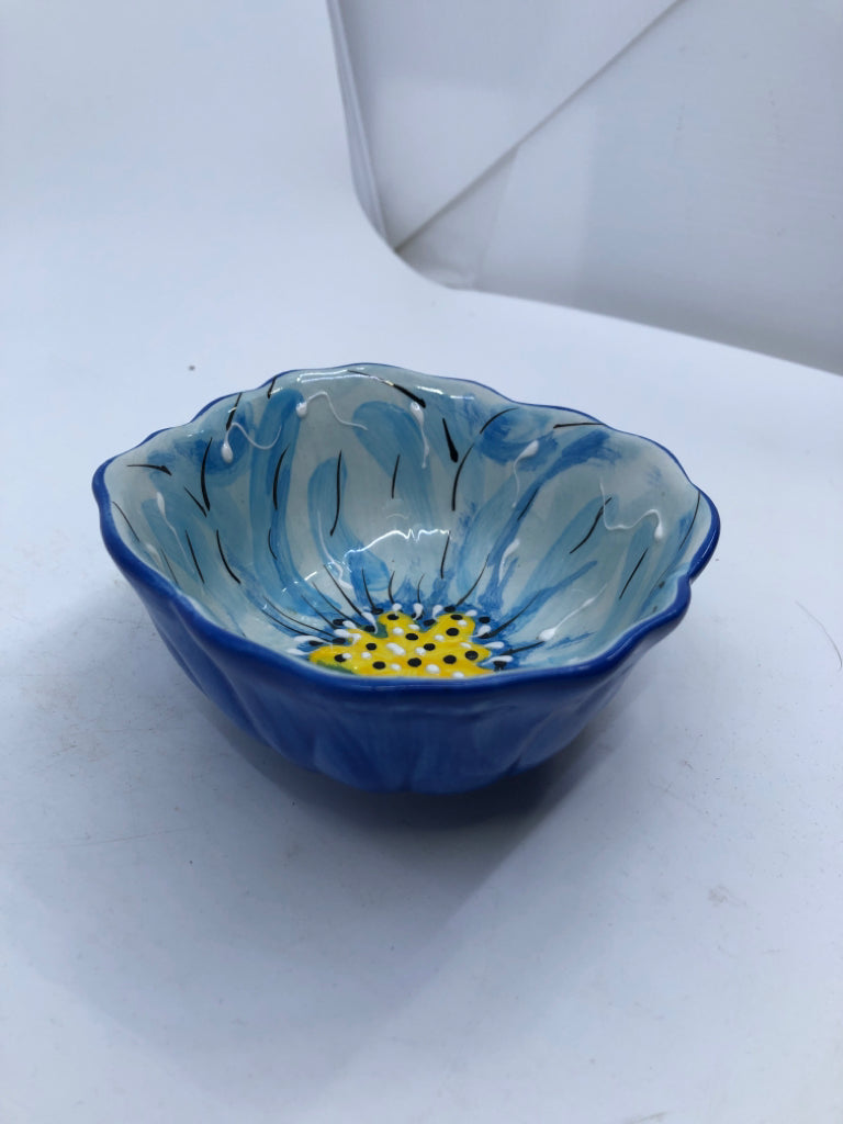 BLUE WITH YELLOW FLOWER.