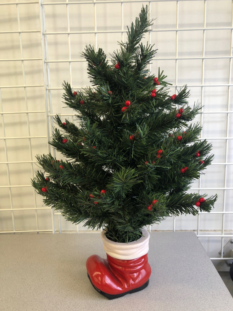 FAUX TREE W/BERRIES IN SANTAS BOOT.