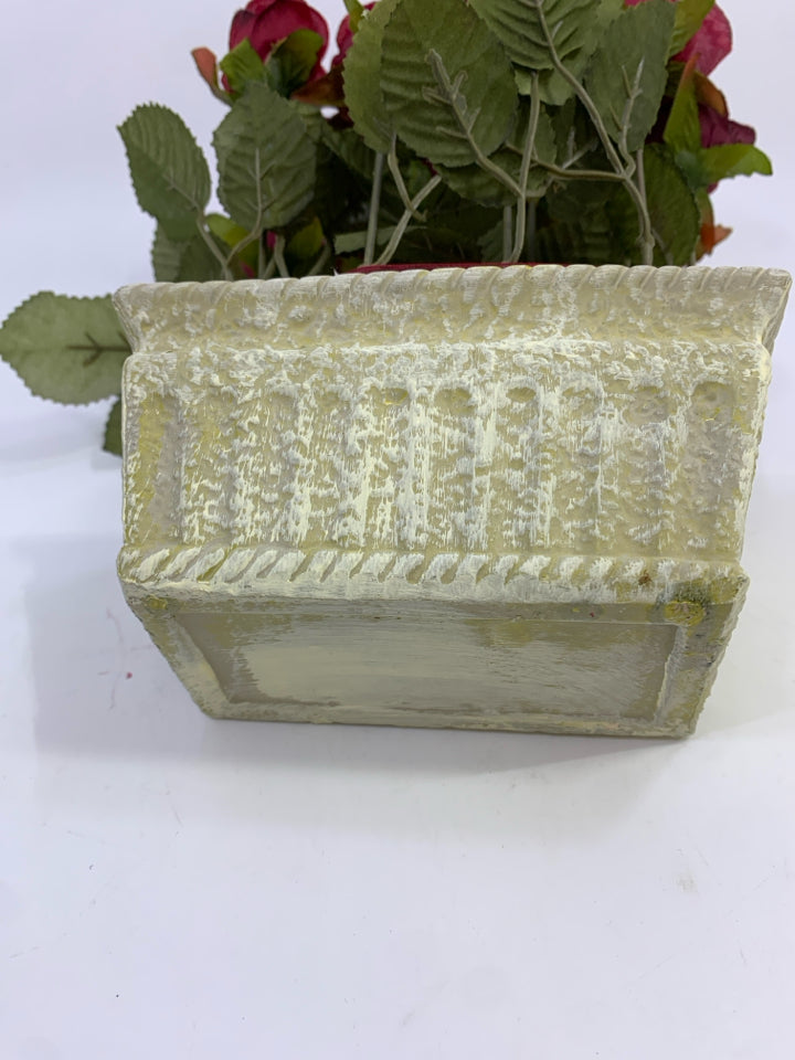 RED ROSE FAUX FLOWERS IN WHITE DECORATED RECTANGULAR POT W/RED RIBBON.