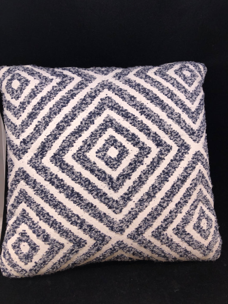 CREAM PILLOW W/BLUE TEXTURED DIAMOND DESIGN.