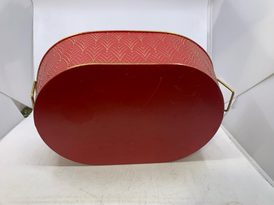 OVAL RED METAL W/ GOLD EMBOSSED DESIGNS.