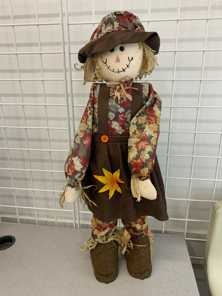 AUTUMN SCARECROW IN BROWN OVERALL DECOR.