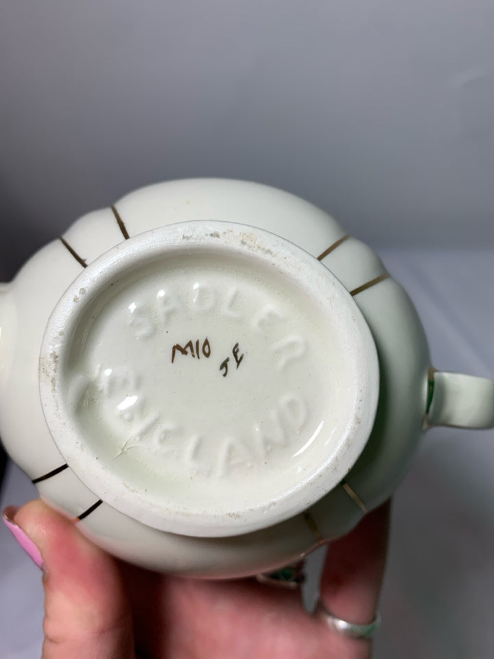 VTG CREAM AND GOLD TEAPOT.