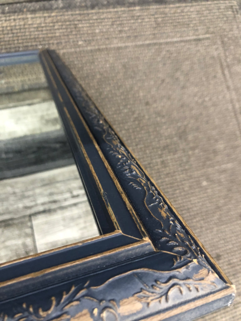 BLUE CARVED WOOD MIRROR.