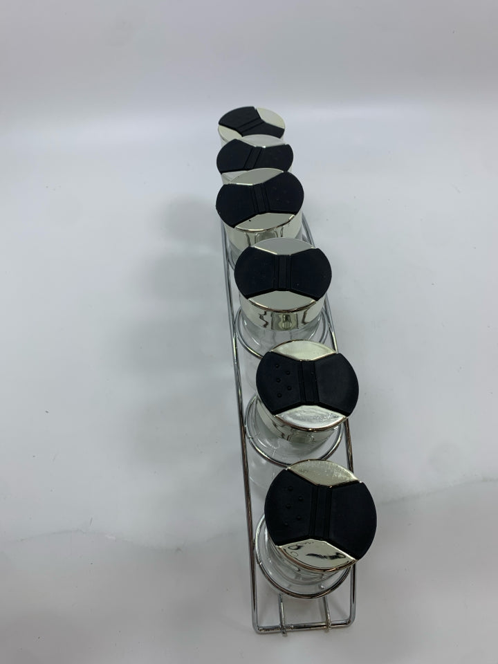 6GLASS SPICE JARS IN METAL STAND.