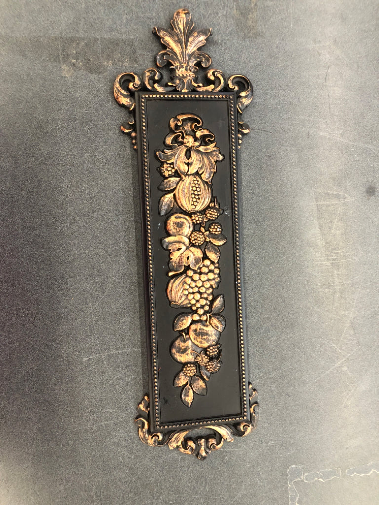 FRUIT EMBOSSED BLACK W BRONZE ACCENTS WALL HANGING.