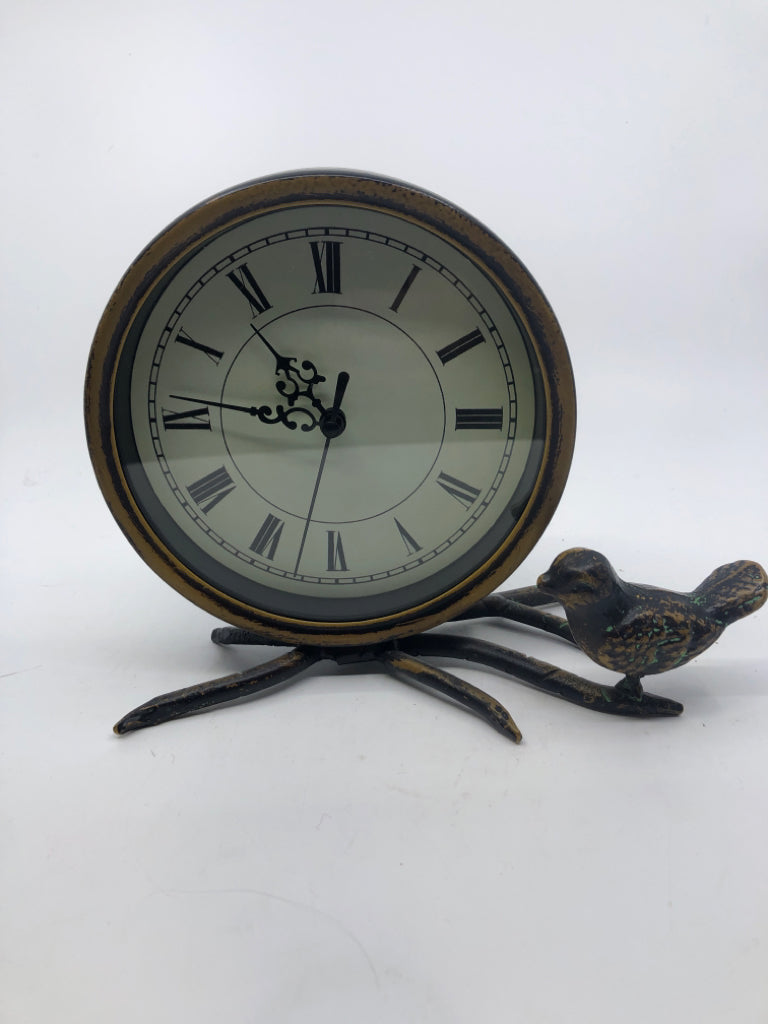 DISTRESSED METAL CIRCLE CLOCK W/ BIRD ON BRANCH.