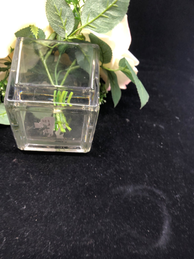 3 LARGE FAUX WHITE ROSES IN CLEAR SQUARE GLASS VASE.