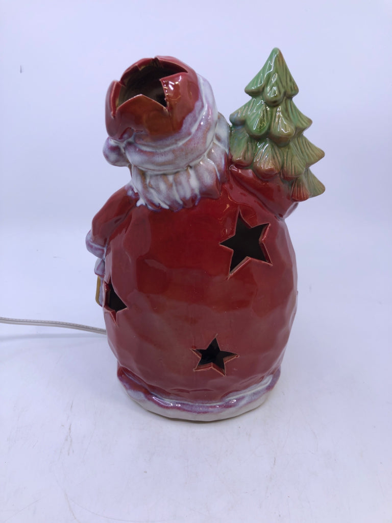 RED CERAMIC LIGHT UP SANTA HOLDING A TREE.